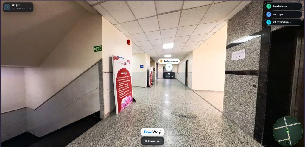 Hallway toward the conference hall with a walk-here marker