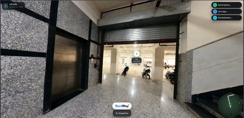 Lift lobby opening toward parking with a walk-here hotspot